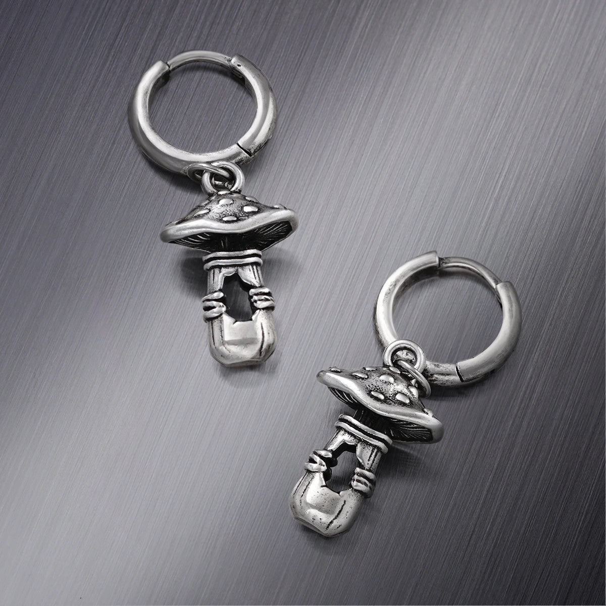 Pair of silver Mystical Mushroom hoop earrings with dangling mushroom figures