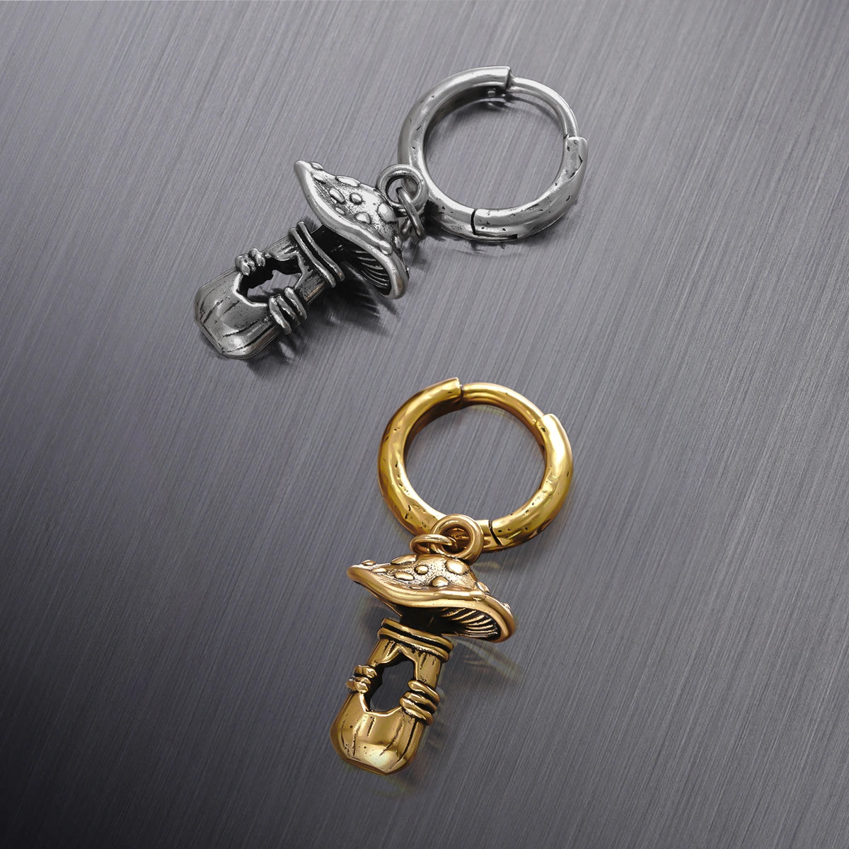Silver and gold Mystical Mushroom hoop earrings displayed together