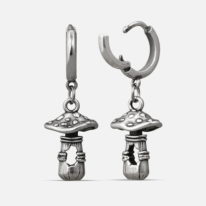 Silver-tone huggie hoop earrings with dangling textured mushroom charms, shown as a matching pair
