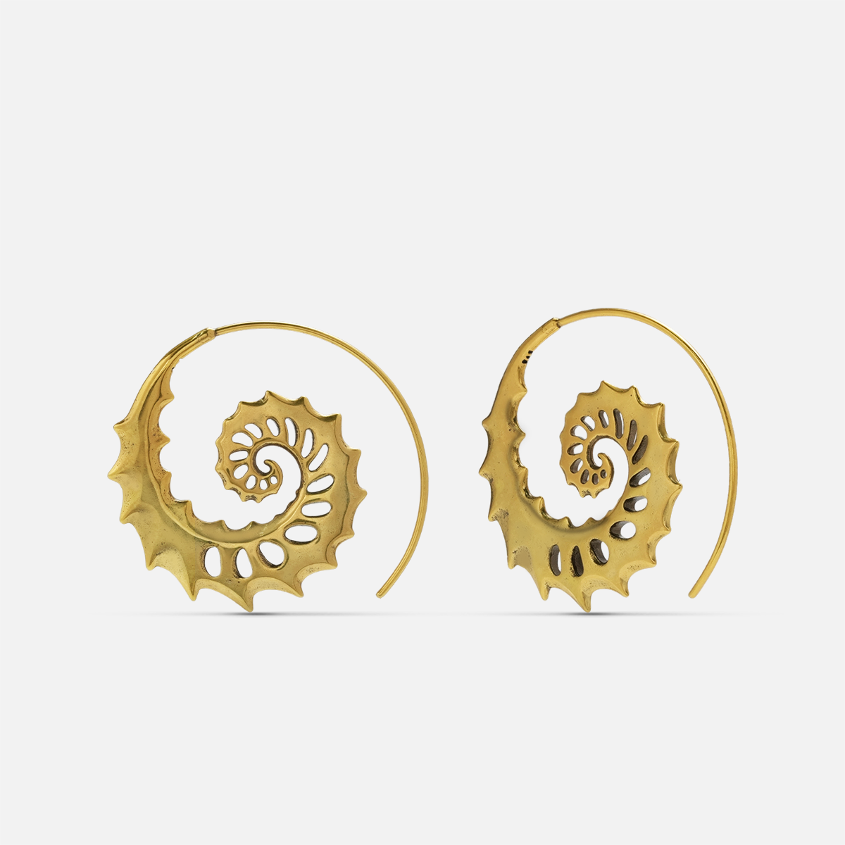 Gold Nautilus Omen Earrings with spiral shell forms, cutout ridges, thorn-like edges, and hoop design on a clean background.