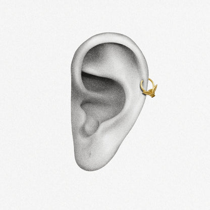 Gold Night Moth Clicker shown on ear placement with sculpted moth wing design