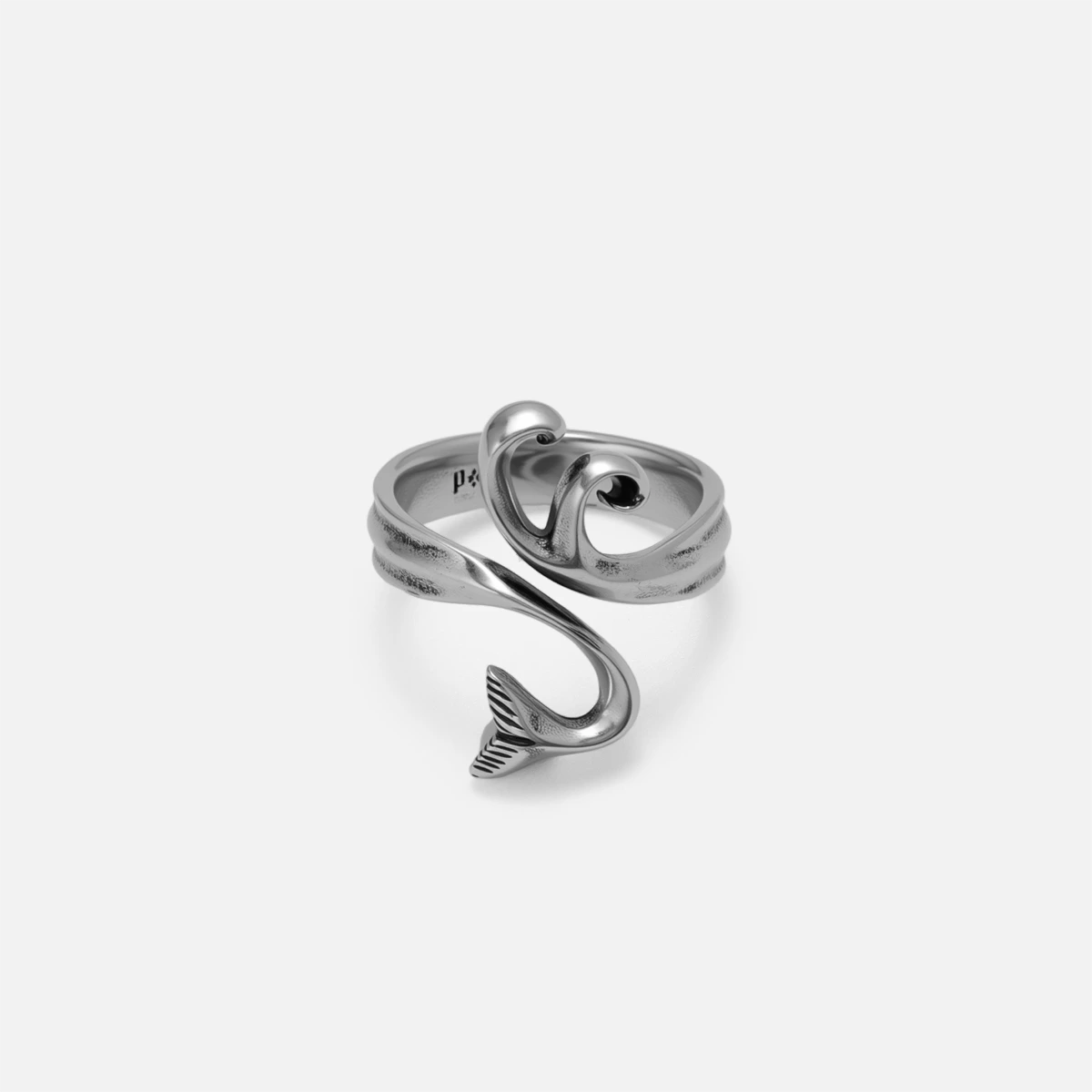 Ocean inspired ring with wave like crests and open band design on plain background