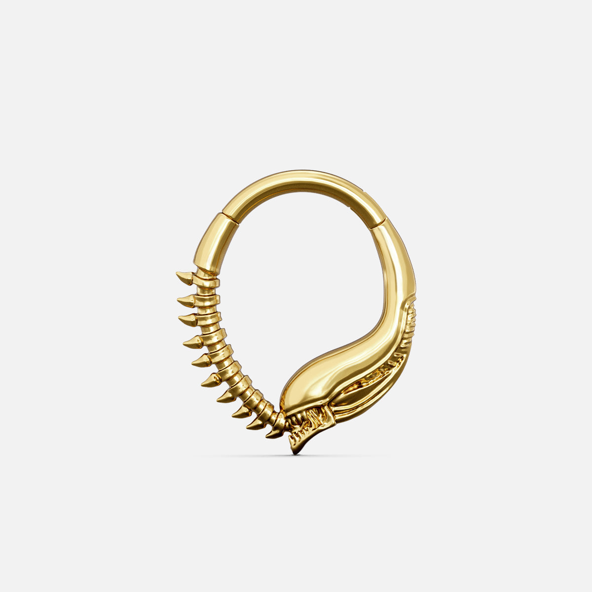 Gold-tone Ouroboros Clicker with a flowing serpent-inspired shape and raised spine detailing.