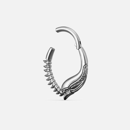 Silver-tone Ouroboros Clicker shown open to display the hinged closure and textured spine details.