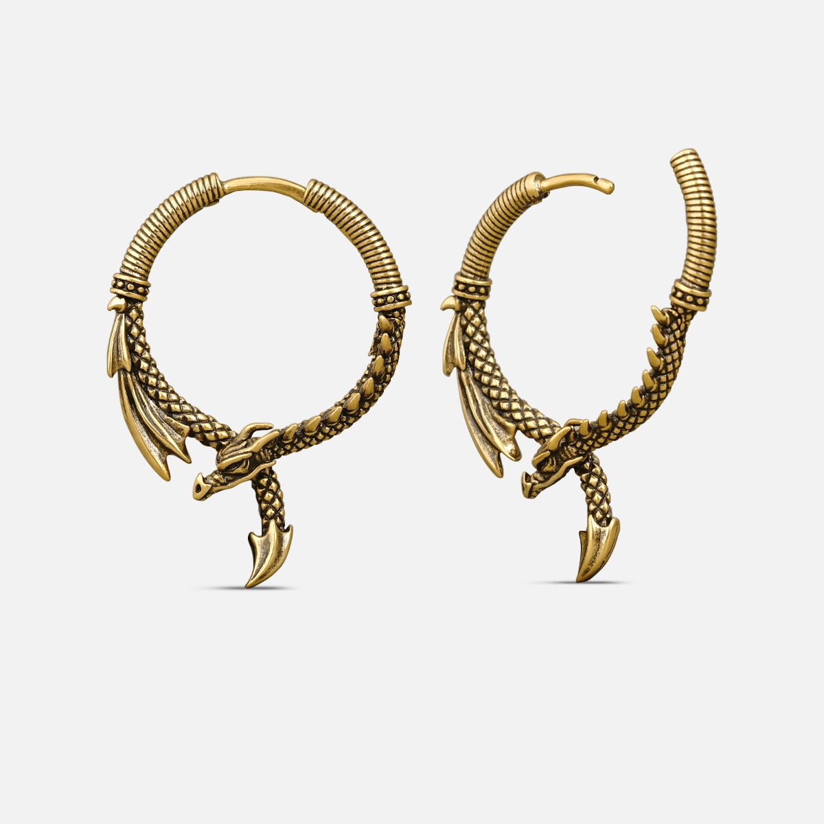 Pair of gold-tone dragon hoop earrings shown from front and side view against a light background