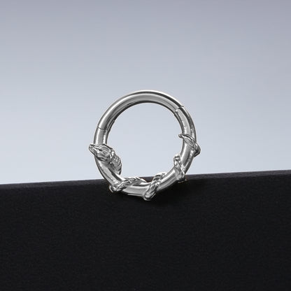 Silver Ouroboros Serpent clicker displayed against a black pedestal