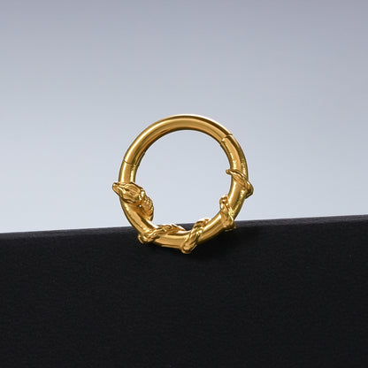 Gold Ouroboros Serpent clicker displayed against a black pedestal