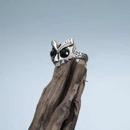 Owl Sentinel Rings displayed on weathered wood with dark woodland relic styling