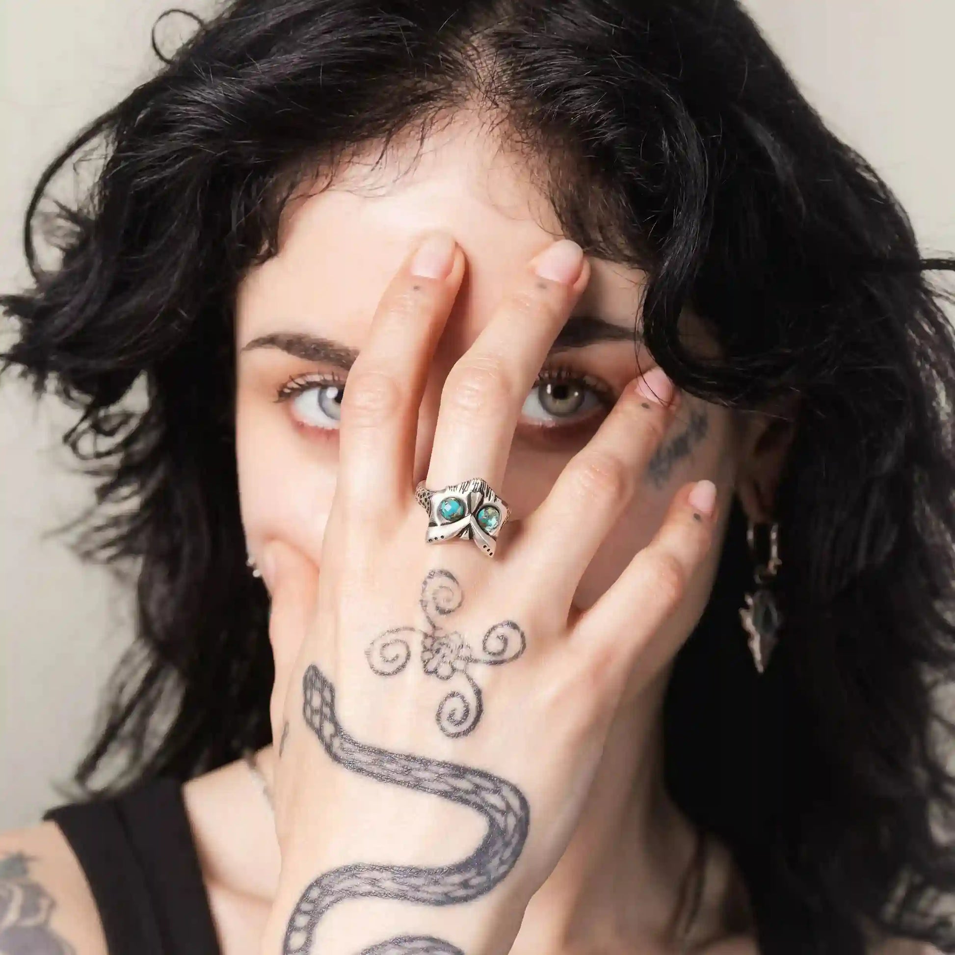 Owl Sentinel Rings styled on model with gothic owl skull design and open band