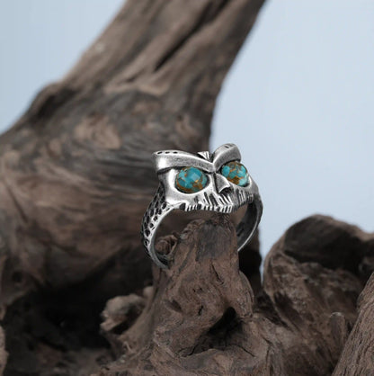 Turquoise Owl Sentinel Ring photographed on driftwood with gothic forest jewelry mood