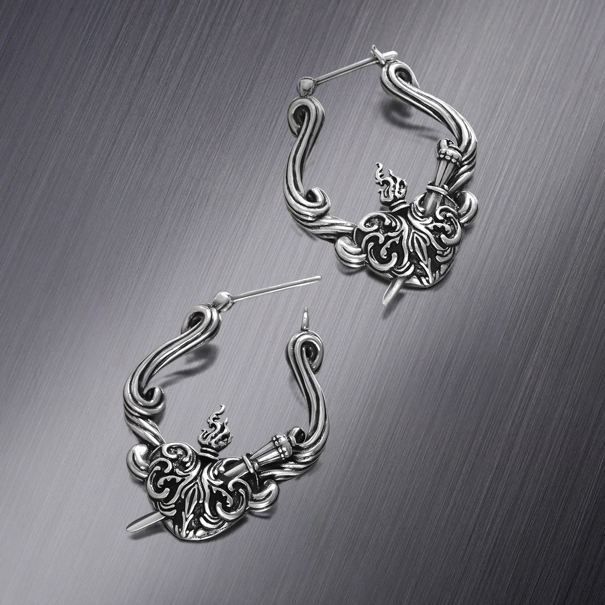 Pair of silver Passionate Heart hoop earrings shown open and closed