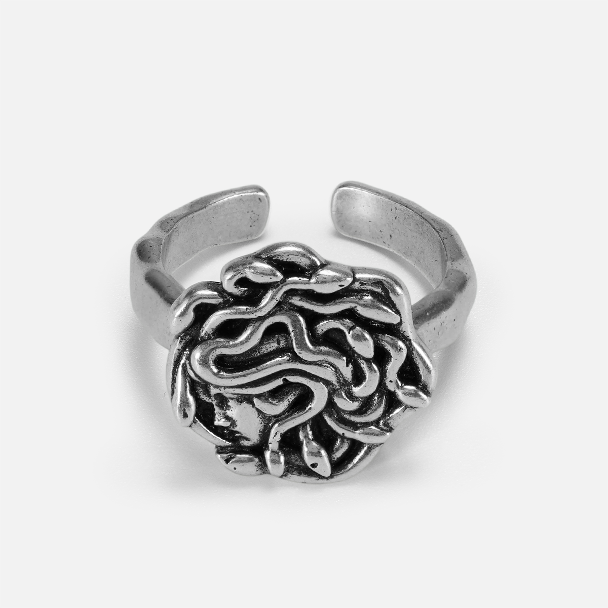 petrified gaze ring in silver shown in a front view, featuring a medusa-inspired ring face with sculptural snake details