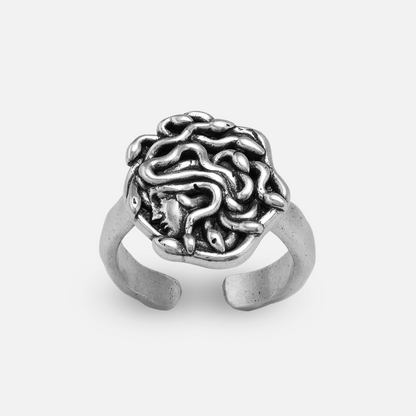 petrified gaze ring in silver shown in a side view, featuring a medusa-inspired ring face with sculptural snake details