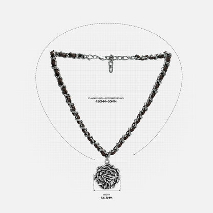 petrified power necklace in silver shown in a size detail view, featuring a medusa-inspired pendant on a braided chain with measurements
