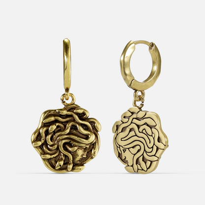 petrifying gaze dangle earrings in gold shown in a front and back view, featuring medusa-inspired drop charms suspended from small hoops