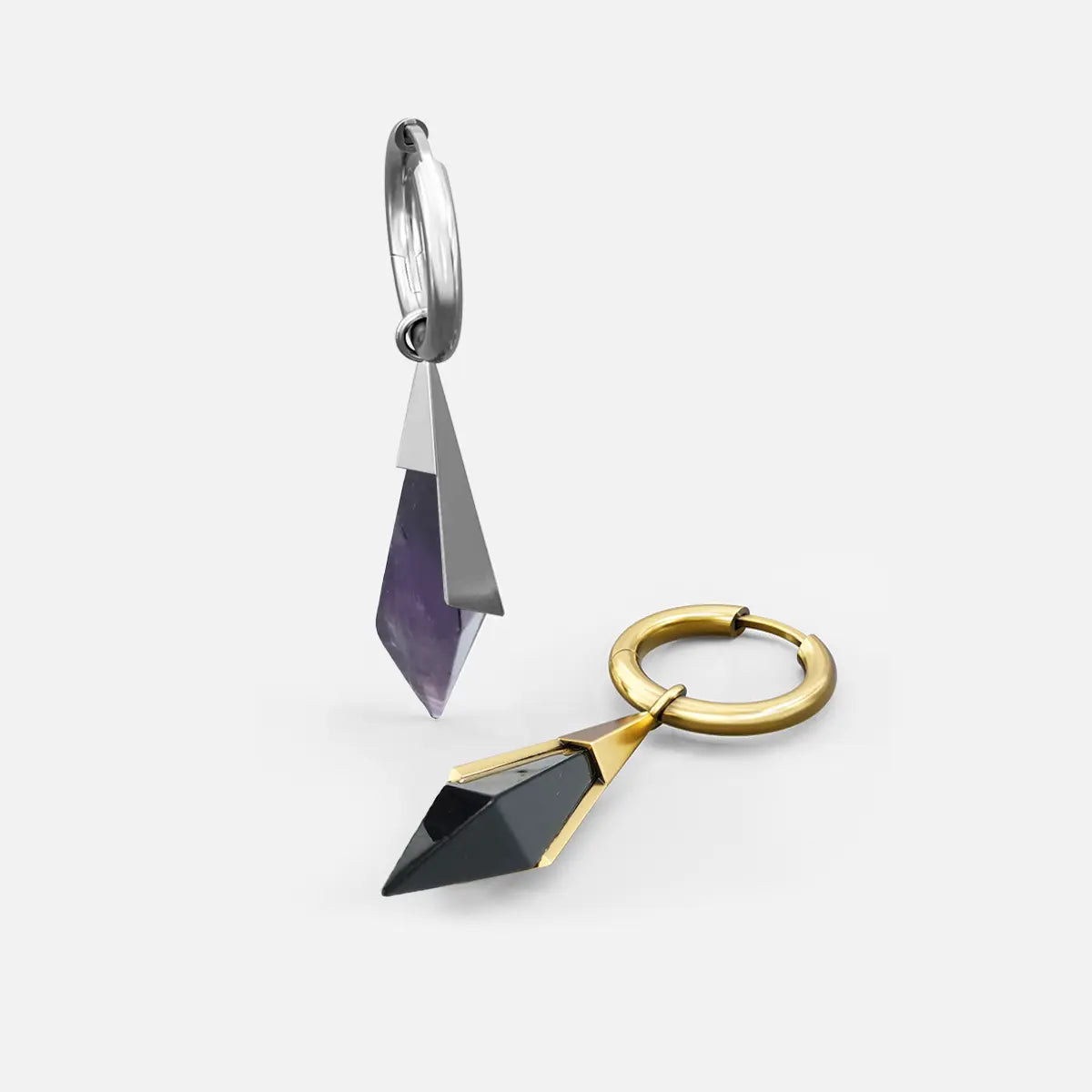 Silver and gold Prism Apex Earrings shown together, featuring faceted crystal drops, polished hoops, and double-tapered silhouettes.