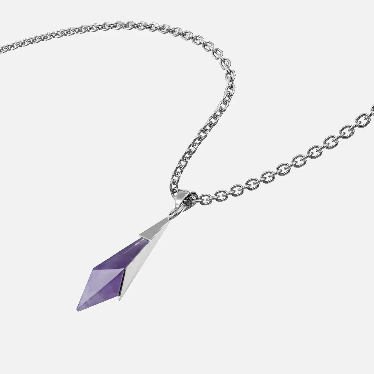 Close-up angled view of the silver-tone Prism Apex Necklace with a faceted purple crystal pendant.