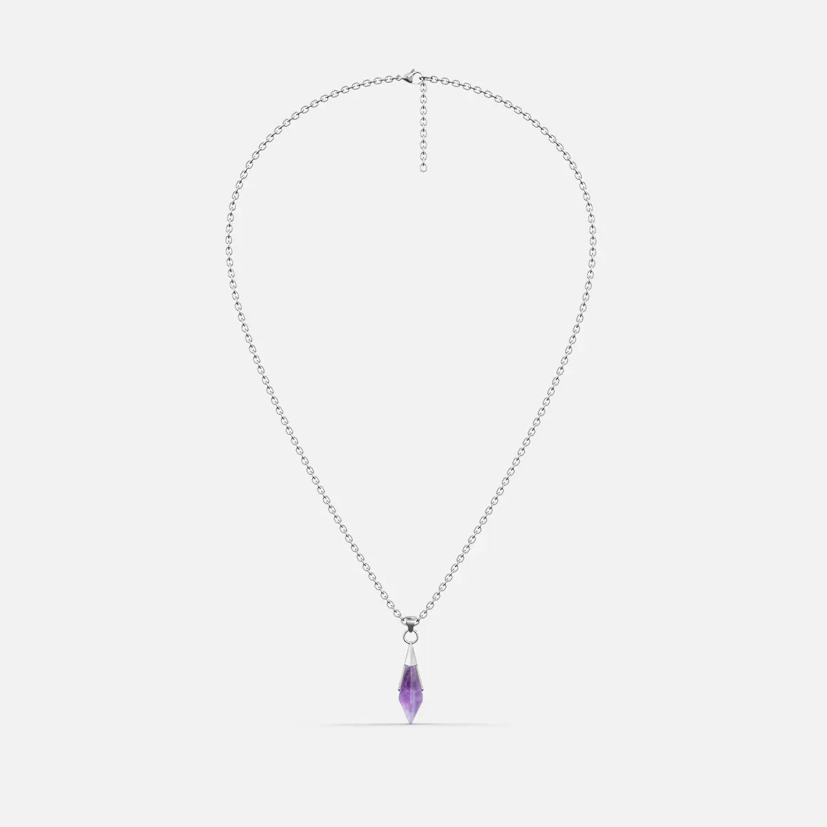 Silver-tone Prism Apex Necklace with a pointed purple crystal pendant on a fine chain, shown on a light gray background.