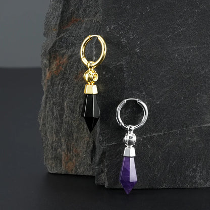 Silver and gold Prism Orb Earrings displayed on a dark stone surface, showing faceted crystal drops, spherical beads, and geometric styling.