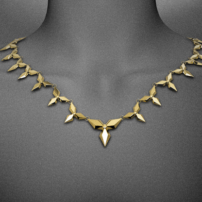 Gold-tone petal necklace with diamond link pattern worn close around the neckline