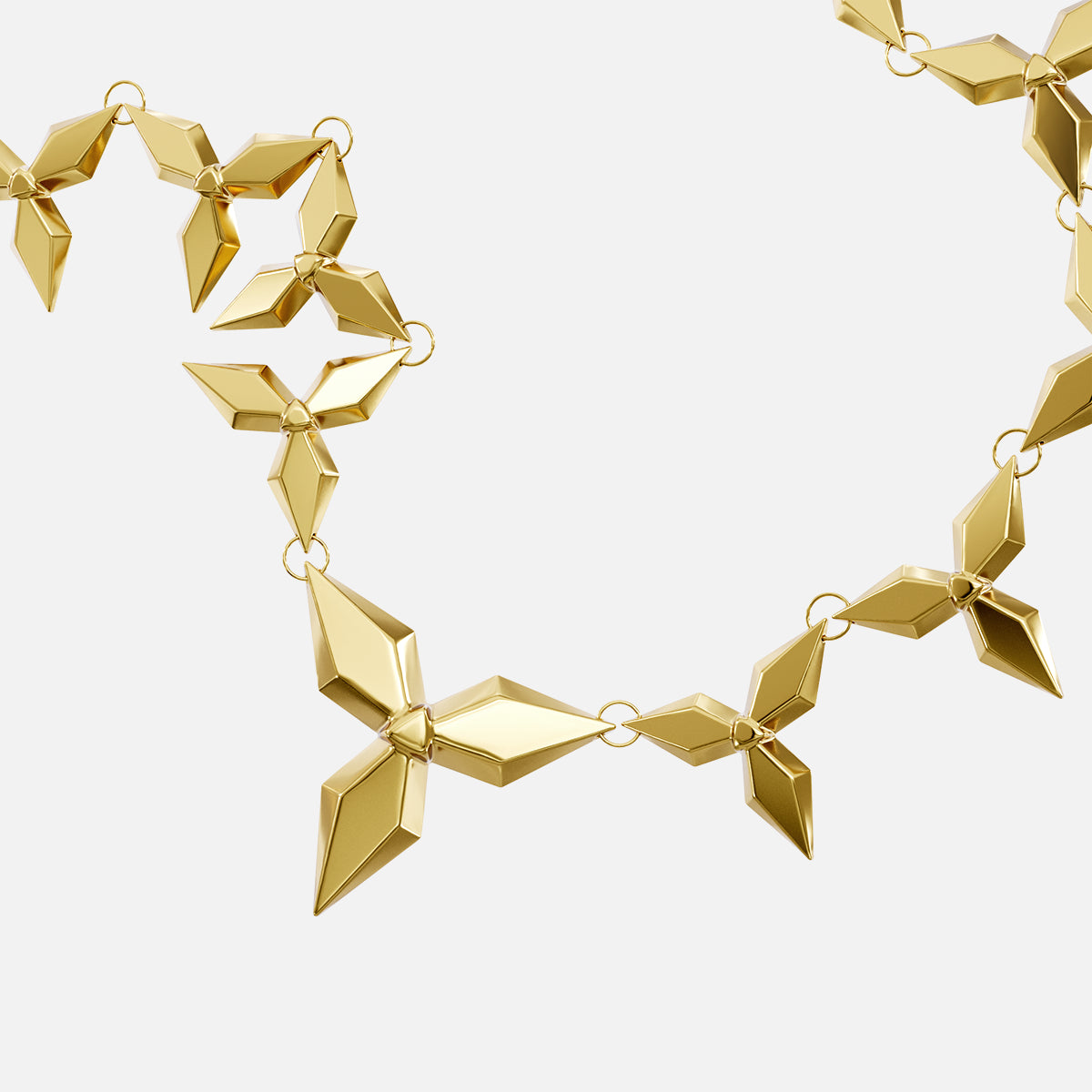 Close-up of gold Punk Petal necklace with pointed geometric links