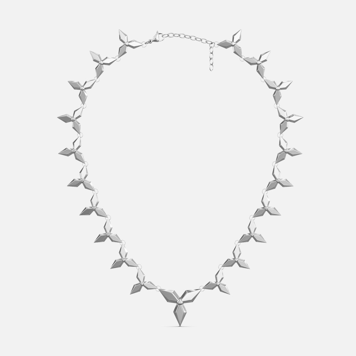 Silver-tone petal necklace with layered diamond-shaped links and a pointed pendant, laid flat
