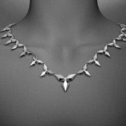 Silver-tone petal necklace with diamond link pattern worn close around the neckline