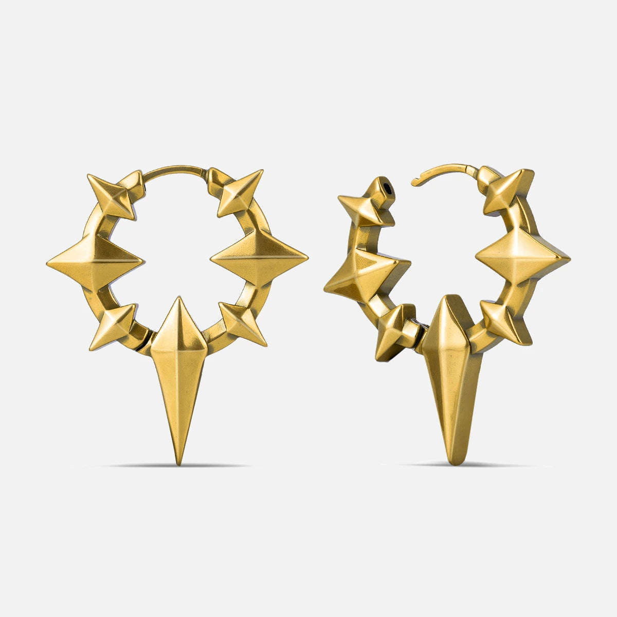 Punkyouth Celestial spike earrings in gold, featuring four-point stars and pointed hoop silhouettes