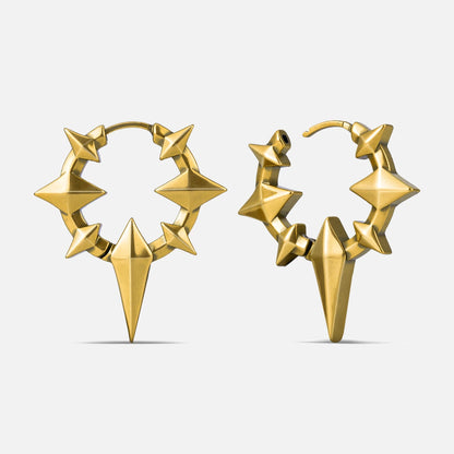 Punkyouth Celestial spike earrings in gold, featuring four-point stars and pointed hoop silhouettes