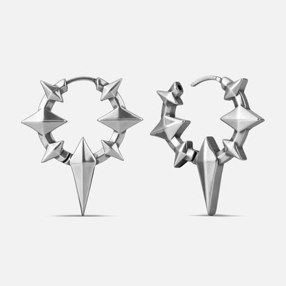 Punkyouth Celestial spike earrings in silver, featuring four-point stars and pointed hoop silhouettes