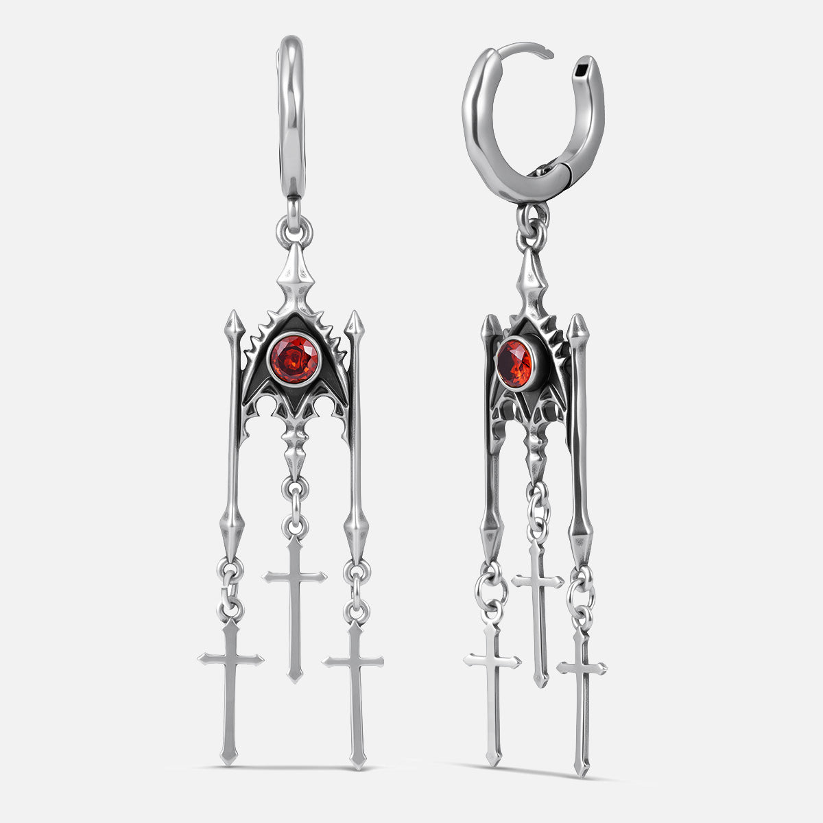 Punkyouth Crimson altar earrings in silver, featuring red cubic zirconia and three dangling cross pendants