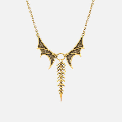 Punkyouth Nocturnal spine necklace in gold, featuring sculpted bat wings and vertebra-inspired drop pendant