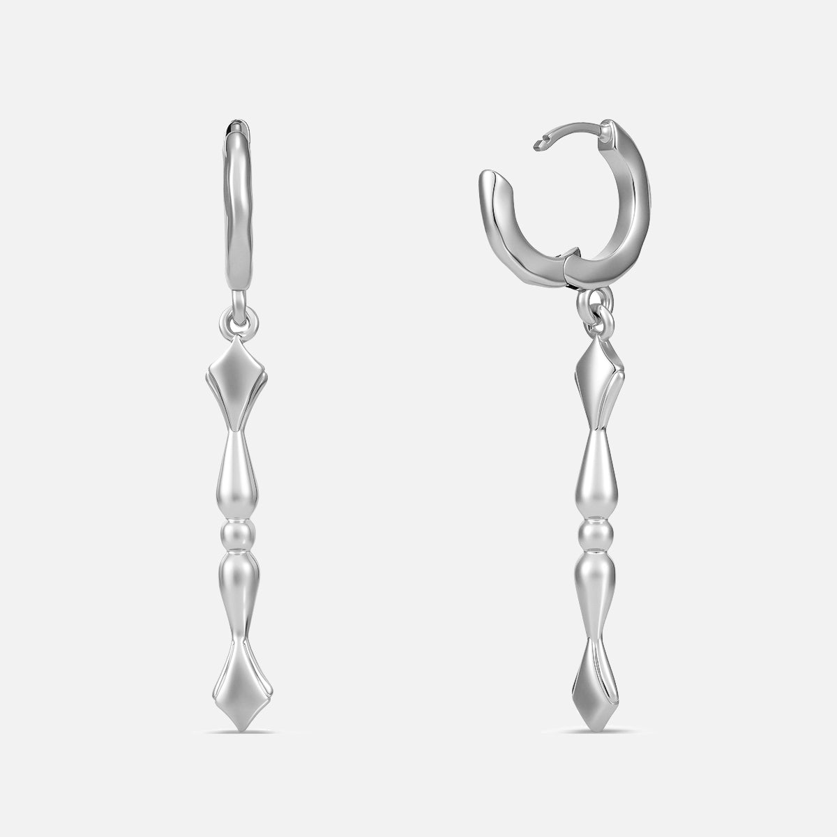 Punkyouth Regal spire earrings in silver, featuring sculpted huggie hoops and tapered spire pendants