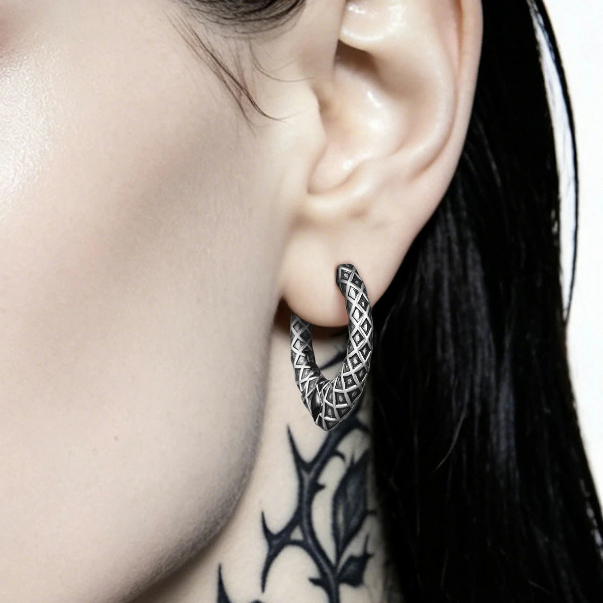 Punkyouth Serpent scale earrings featuring scale-textured hoops and black resin accents, product image 02