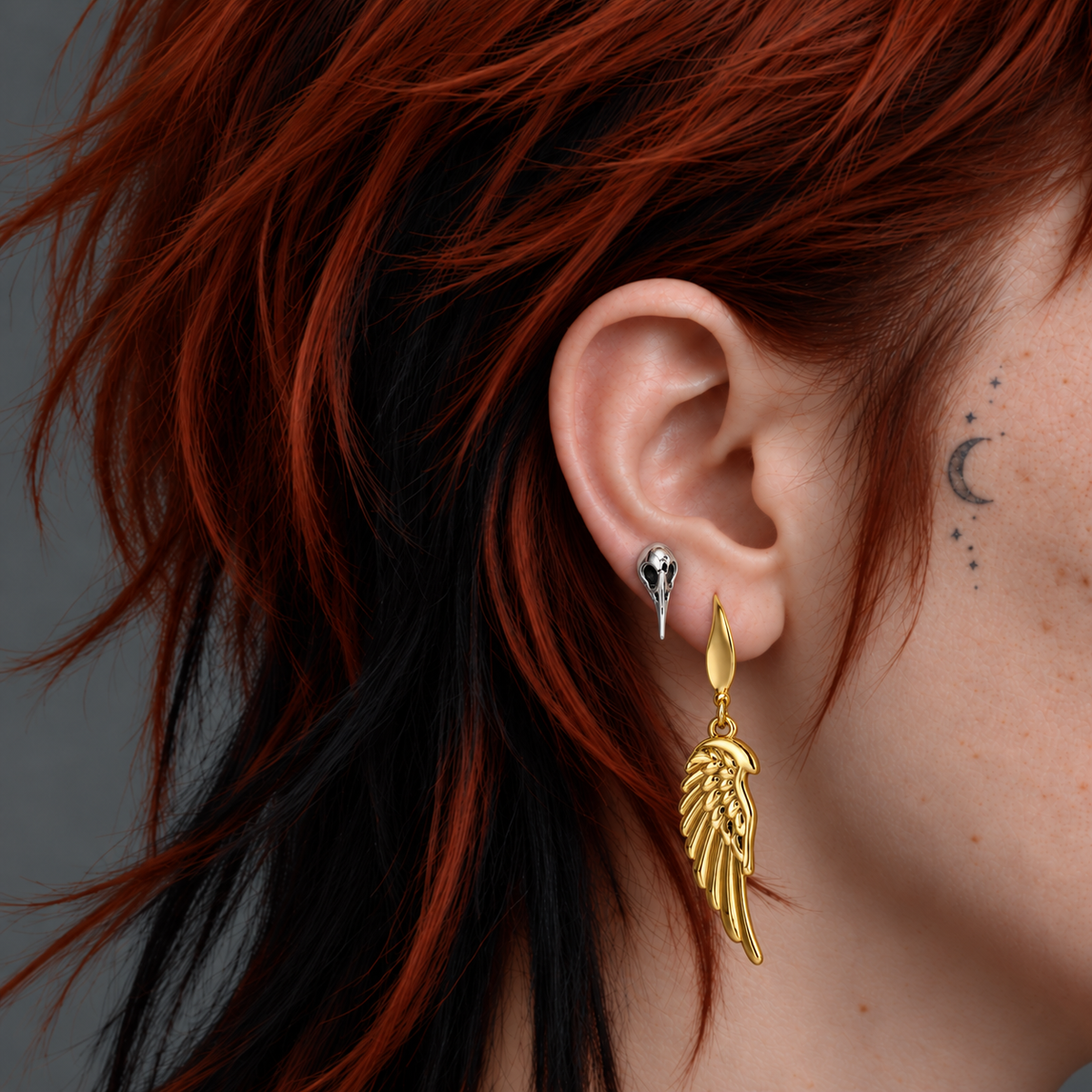 PUNKYOUTH Wing and carrion ear stack: Golden Wing Drop Earrings + Carrion Bird Skull Ear Stud. Each jewellery design is sold separately.