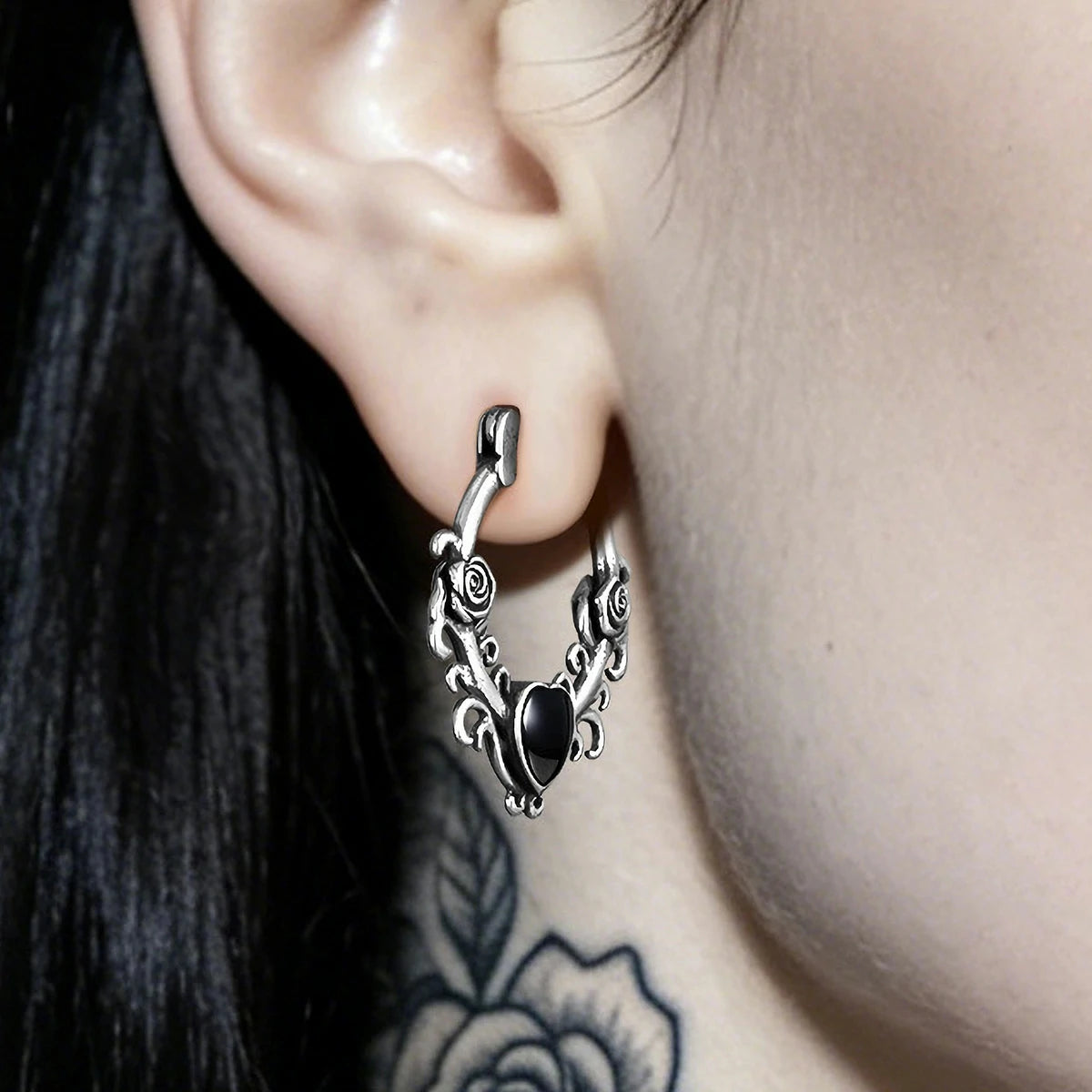 Punkyouth Thornheart earrings featuring sculpted roses and black heart-shaped resin centers, product image 02