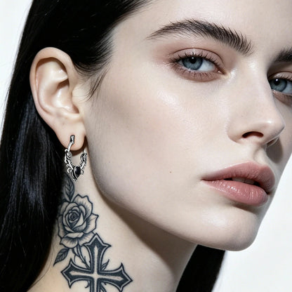 Punkyouth Thornheart earrings featuring sculpted roses and black heart-shaped resin centers, product image 03