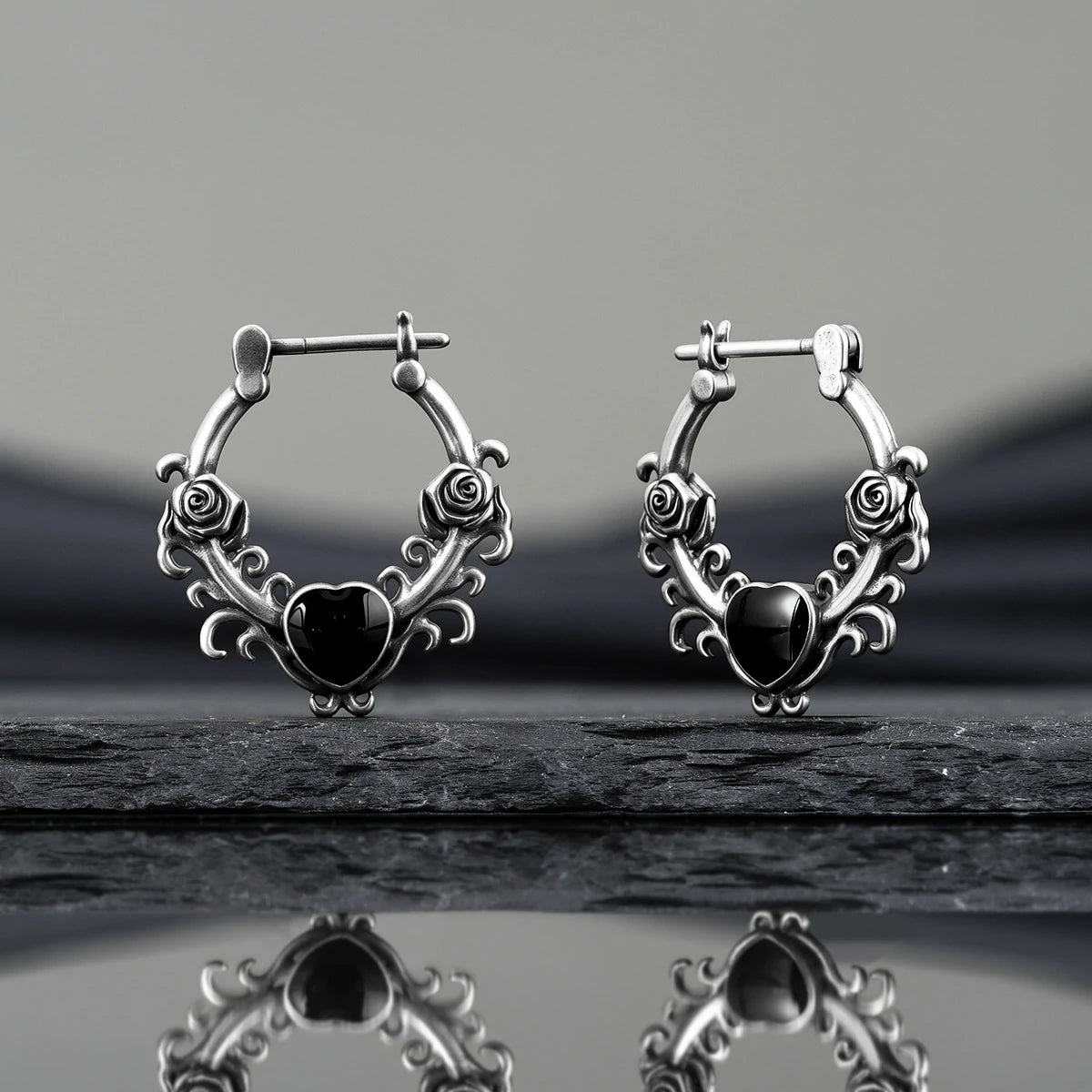 Punkyouth Thornheart earrings featuring sculpted roses and black heart-shaped resin centers, product image 07