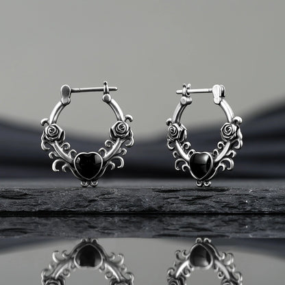 Punkyouth Thornheart earrings featuring sculpted roses and black heart-shaped resin centers, product image 07