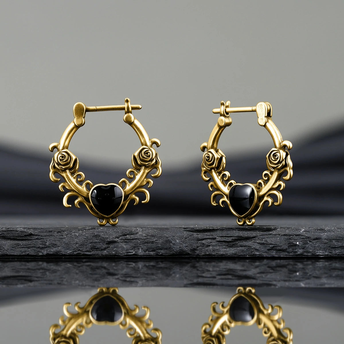Punkyouth Thornheart earrings featuring sculpted roses and black heart-shaped resin centers, product image 09