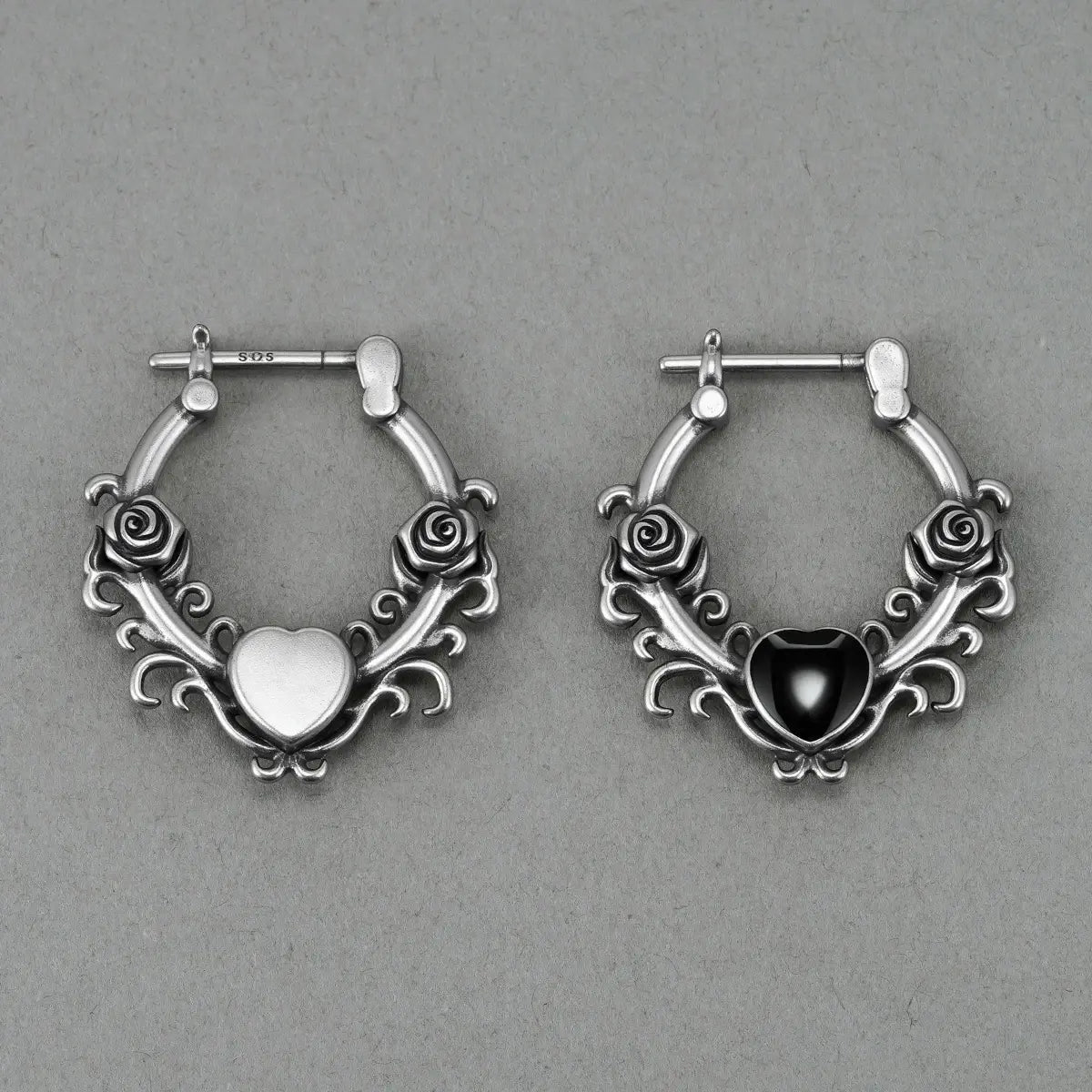 Punkyouth Thornheart earrings featuring sculpted roses and black heart-shaped resin centers, product image 11
