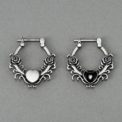 Punkyouth Thornheart earrings featuring sculpted roses and black heart-shaped resin centers, product image 11