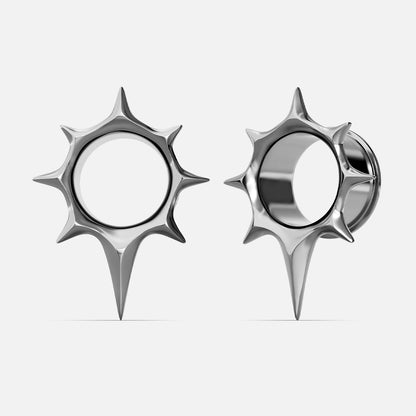Pair of silver-tone star-shaped tunnel earrings shown front and side view with open center circle