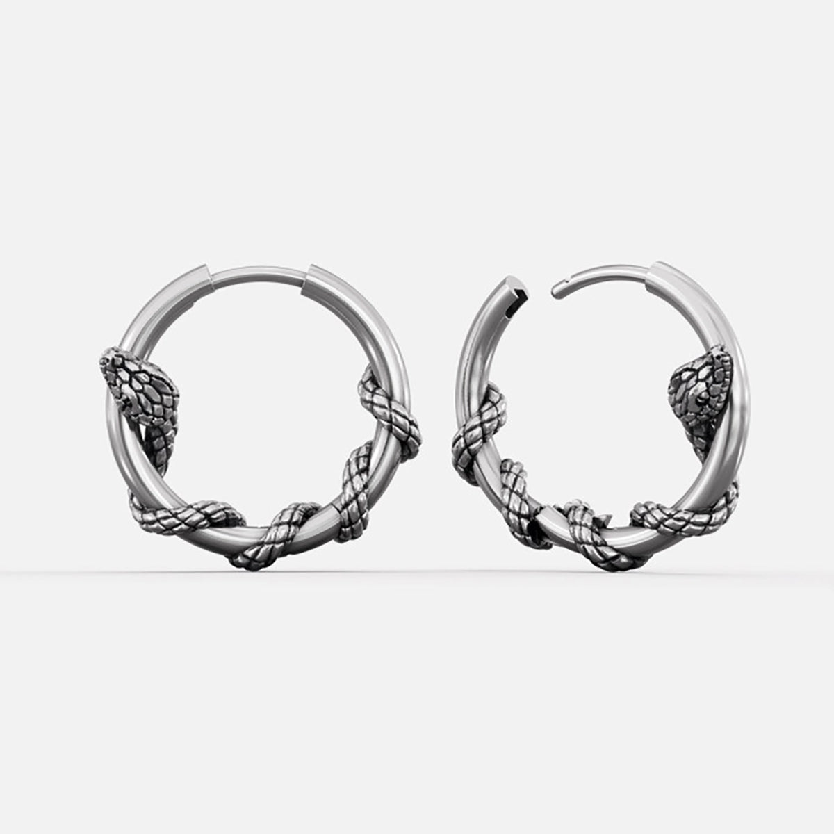 Silver-tone Rebirth Cycle hoop earrings with coiled serpent details around the lower arc