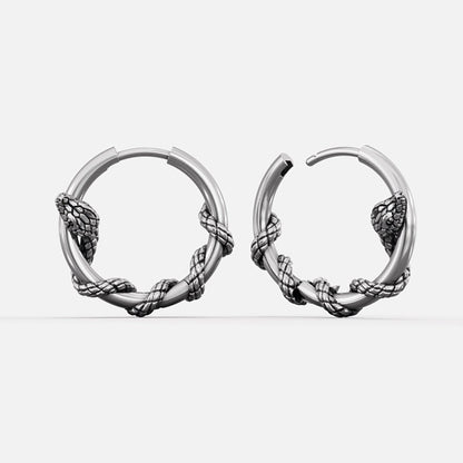 Silver-tone Rebirth Cycle hoop earrings with coiled serpent details around the lower arc