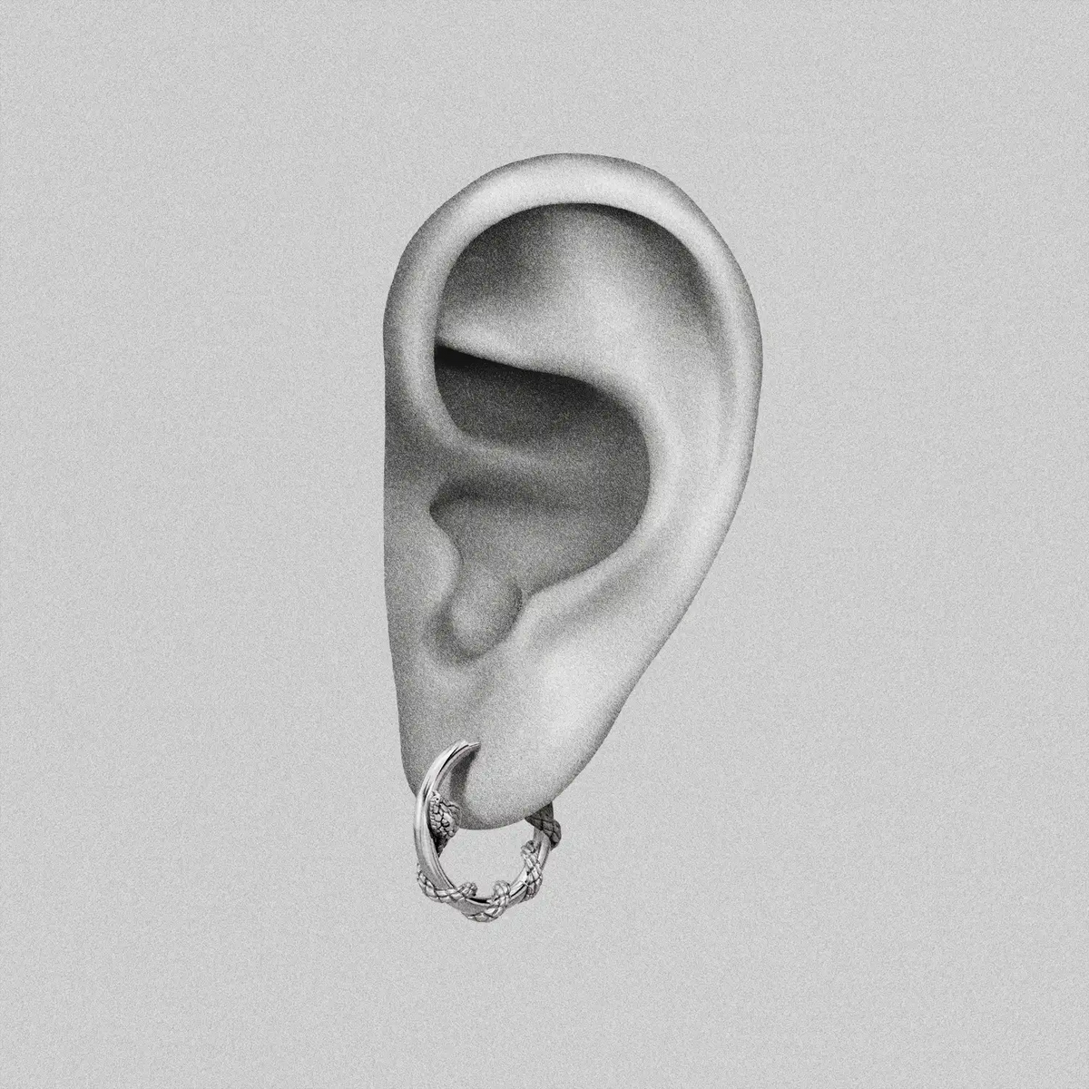 Illustrated ear graphic displaying a silver-tone hoop earring with a thorny vine texture