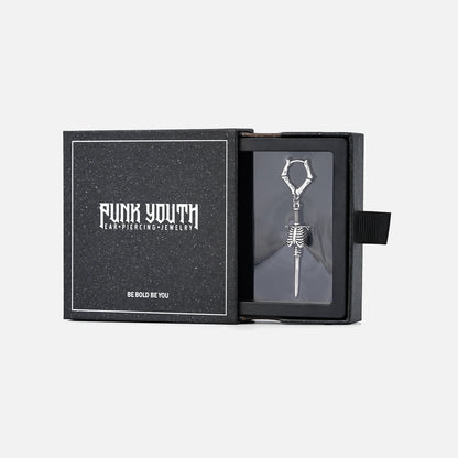Silver Ribcage Blade earring presented in a black PUNKYOUTH jewelry box