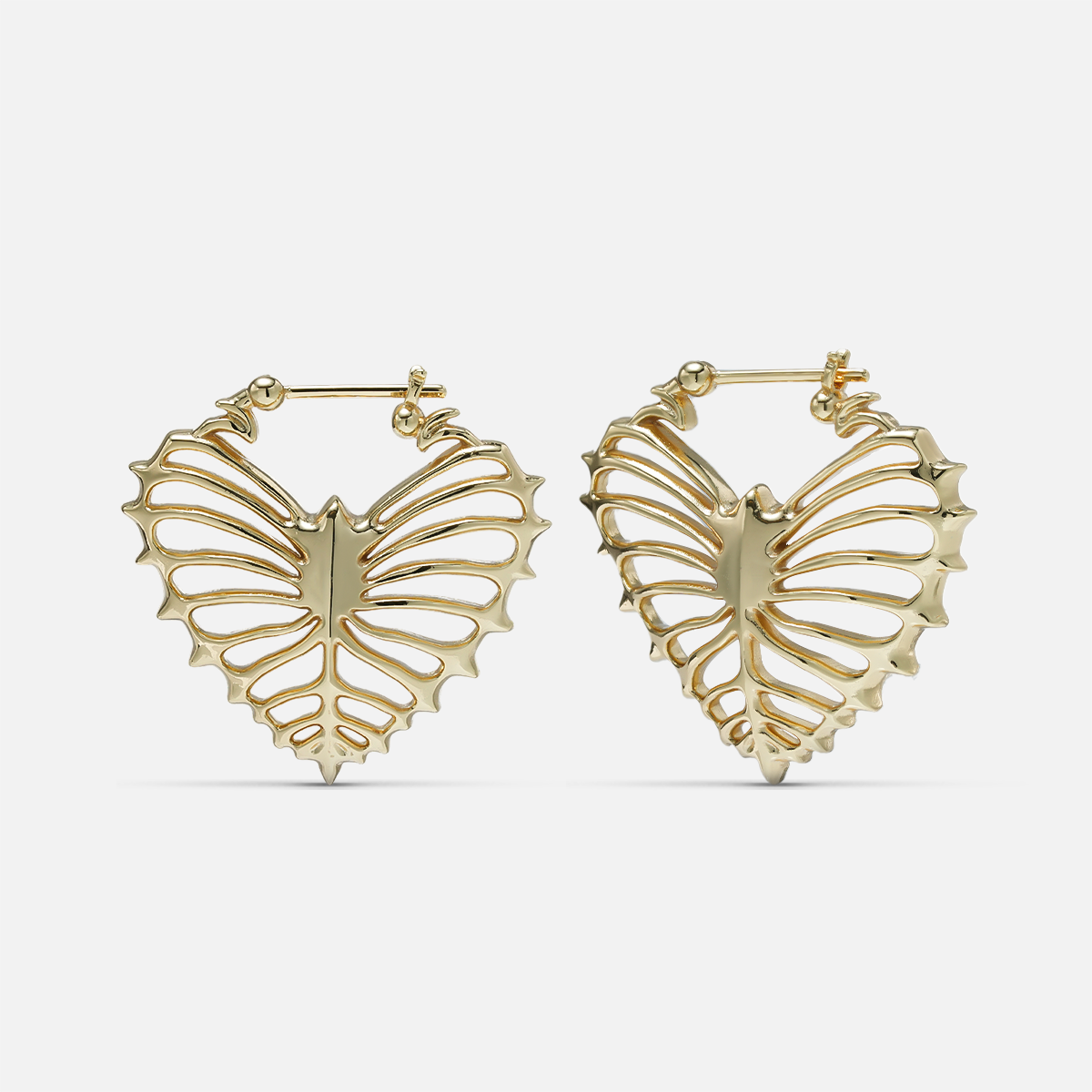 Gold-tone ribheart earrings pair with heart-shaped rib cage design, front view on white background