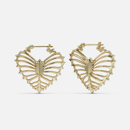 Gold-tone ribheart earrings pair with heart-shaped rib cage design, front view on white background