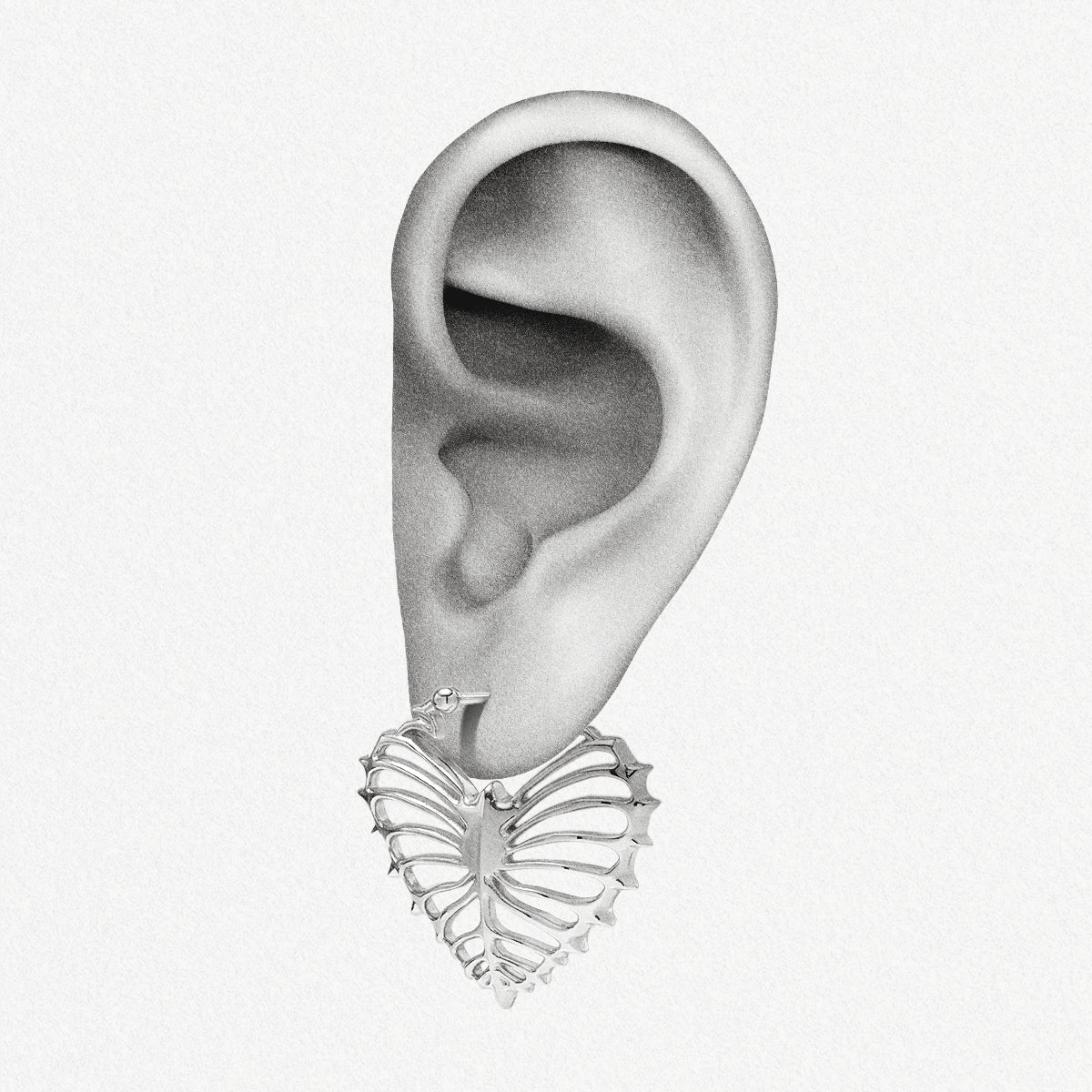 Silver Ribheart earring shown on an ear illustration